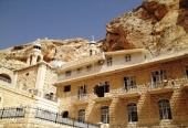 A delegation from Russian visits an old monastery under restoration in Syrian Maaloula