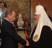 Встреча Святейшего Патриарха Алексия и президента России Владимира Путина в день рождения Его Святейшества